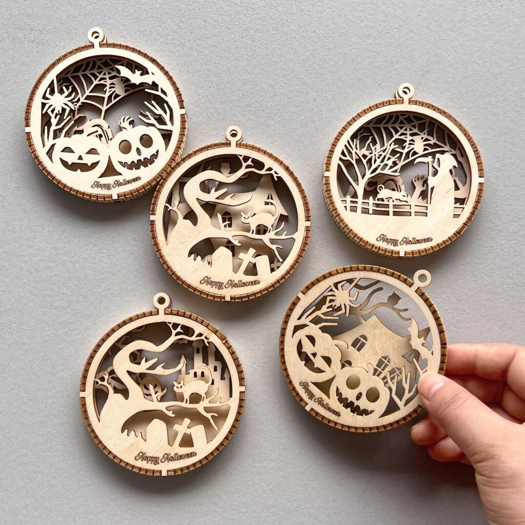 Laser cut wooden Halloween ornaments set with 3D layered pumpkin and ghost design for seasonal hanging decor